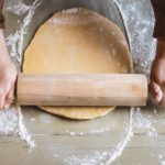 pinning wheel spreading dough